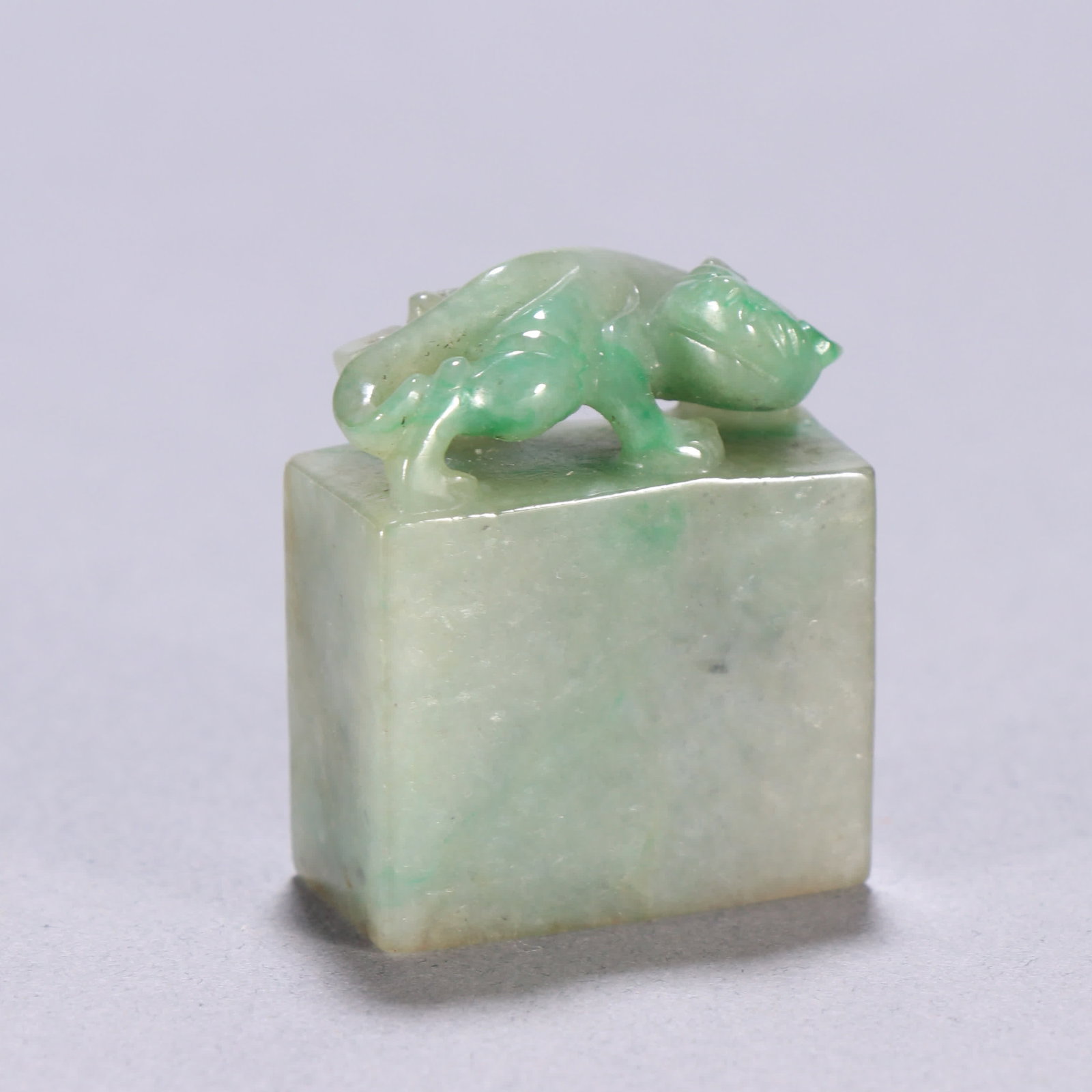 A Qing dynasty jadeite seal with a chi dragon knob (1 of 9)