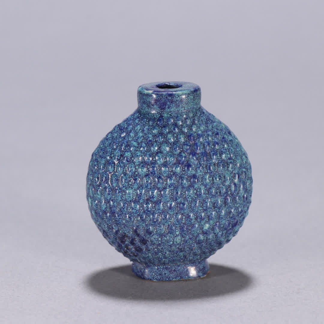 A snuff bottle with Qing dynasty furnace Jun glaze and Luo pattern: Qing Dynasty: Lujun glaze snuff bottle with basket and snuff patterns SIZE: H:5cm W:4.3cm (The Dimensions Of All Batches Are Manually Measured.If You Need More Detailed Information, Please Contact Our