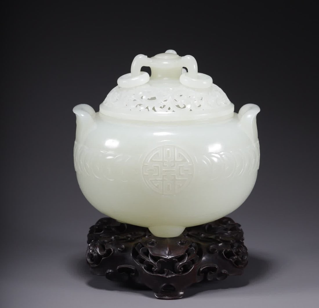 One is a Qing Dynasty Hetian jade double-handled three-legged burner: Qing Dynasty Hetian jade double-handled three-legged stove SIZE: D:10.3cm H:10cm W:382.2g (The Dimensions Of All Batches Are Manually Measured.If You Need More Detailed Information, Please Contact Our