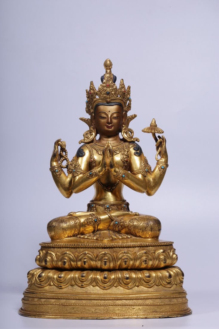 A Qing Dynasty gilded bronze inlaid four-armed Guanyin statue: A Qing Dynasty gilded bronze inlaid four-armed Guanyin statue SIZE: H:34cm L:22cm W:16cm W:6450g (The Dimensions Of All Batches Are Manually Measured.If You Need More Detailed Information, Please Cont
