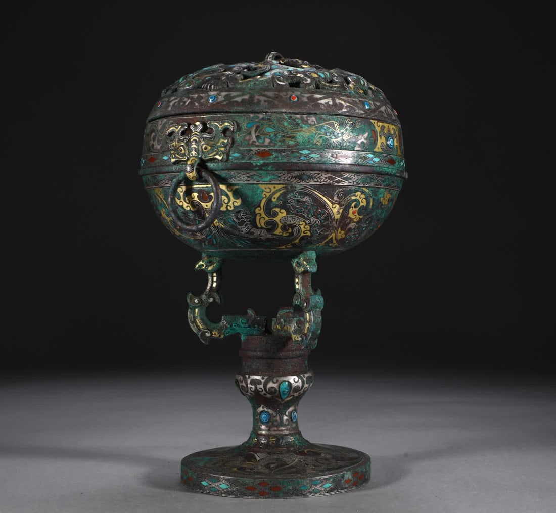 A Warcraft bronze incense burner inlaid with gold and silver inlaid with turquoise and high-footed: Zhan Han Bronze inlaid with gold and silver inlaid with turquoise and tall bean-shaped incense burner SIZE: H:28cm W:19.6cm W:2750g (The Dimensions Of All Batches Are Manually Measured.If You Need