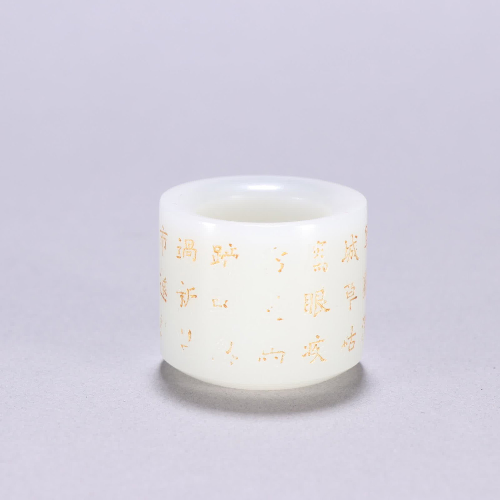 A Qing dynasty Hetian jade finger ring with gold inscription poetry: Qing dynasty Hetian jade finger ring with gold-painted poems and prose SIZE: Inner diameter 2.3cm W: 3cm W: 50.7g (The Dimensions Of All Batches Are Manually Measured.If You Need More Detailed Informa