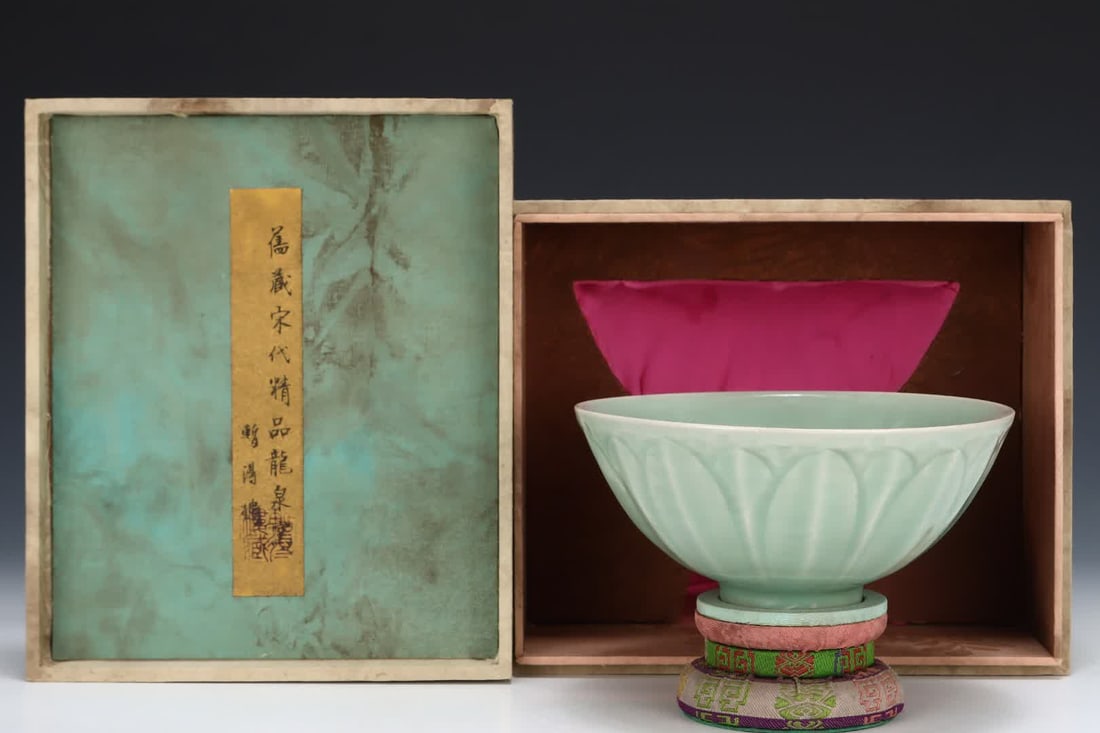 One is a Song Dynasty Longquan powder-celadon lotus petal bowl (1 of 9)