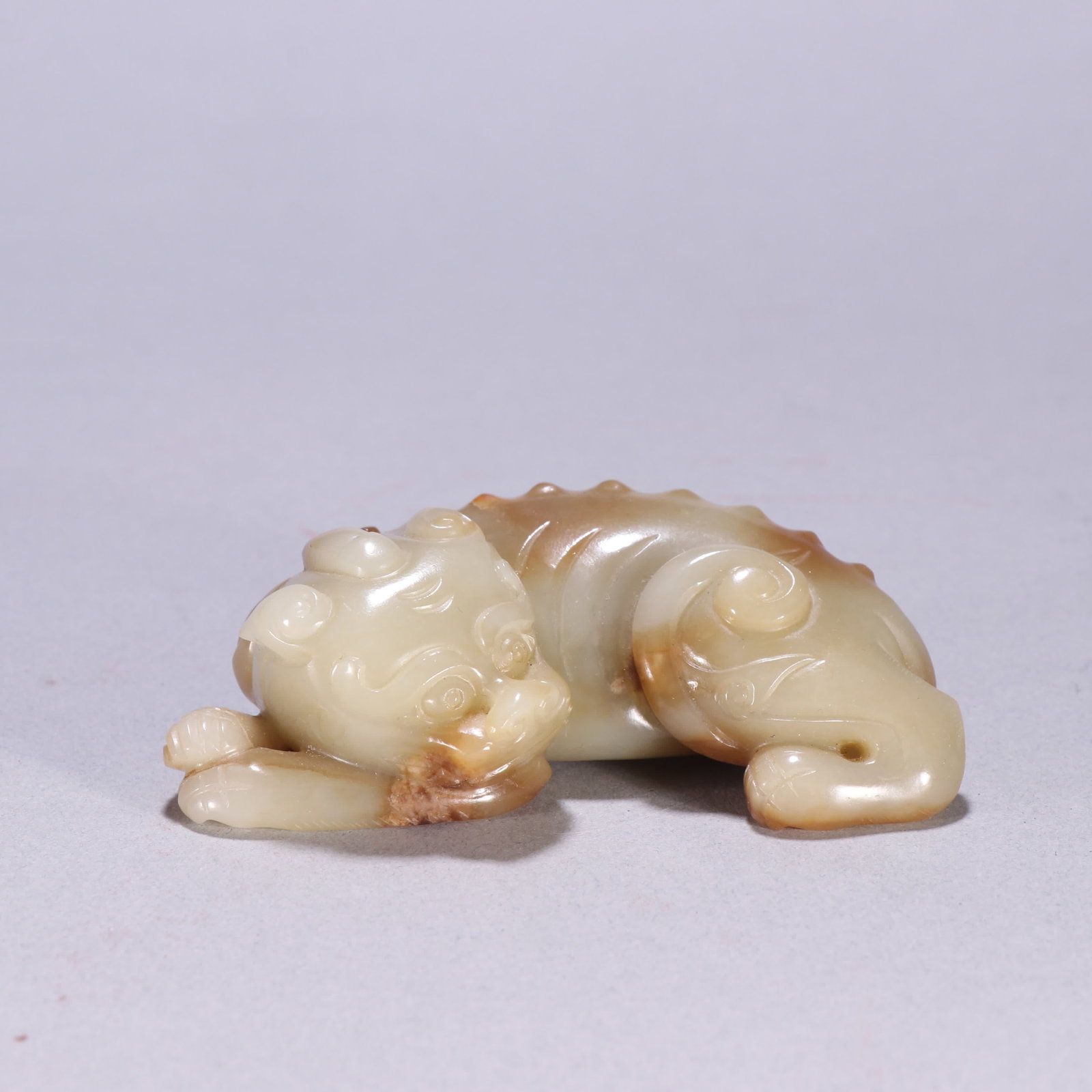 A Qing dynasty Hetian jade beast carving (1 of 9)