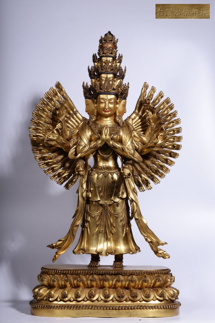 A bronze gilt Thousand-Armed Guanyin statue from the Yongle period of the Ming Dynasty: During the Yongle period of the Ming Dynasty, a gilt bronze statue of the Thousand-Armed Guanyin was commissioned SIZE: H:69cm L:34cm W:18.5cm W:24.25kg (The Dimensions Of All Batches Are Manually Mea