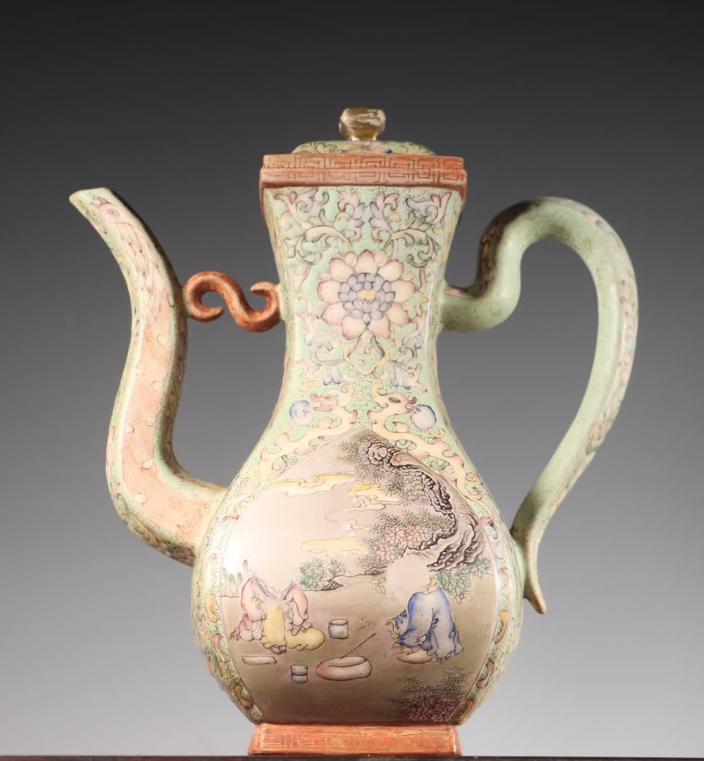 A Qing Dynasty enamel painted infant playing Zisha teapot: Qing Dynasty enamel painted infant play painting Yixing teapot SIZE: 19x10x23.5cm W:702g (The Dimensions Of All Batches Are Manually Measured.If You Need More Detailed Information, Please Contact Our 