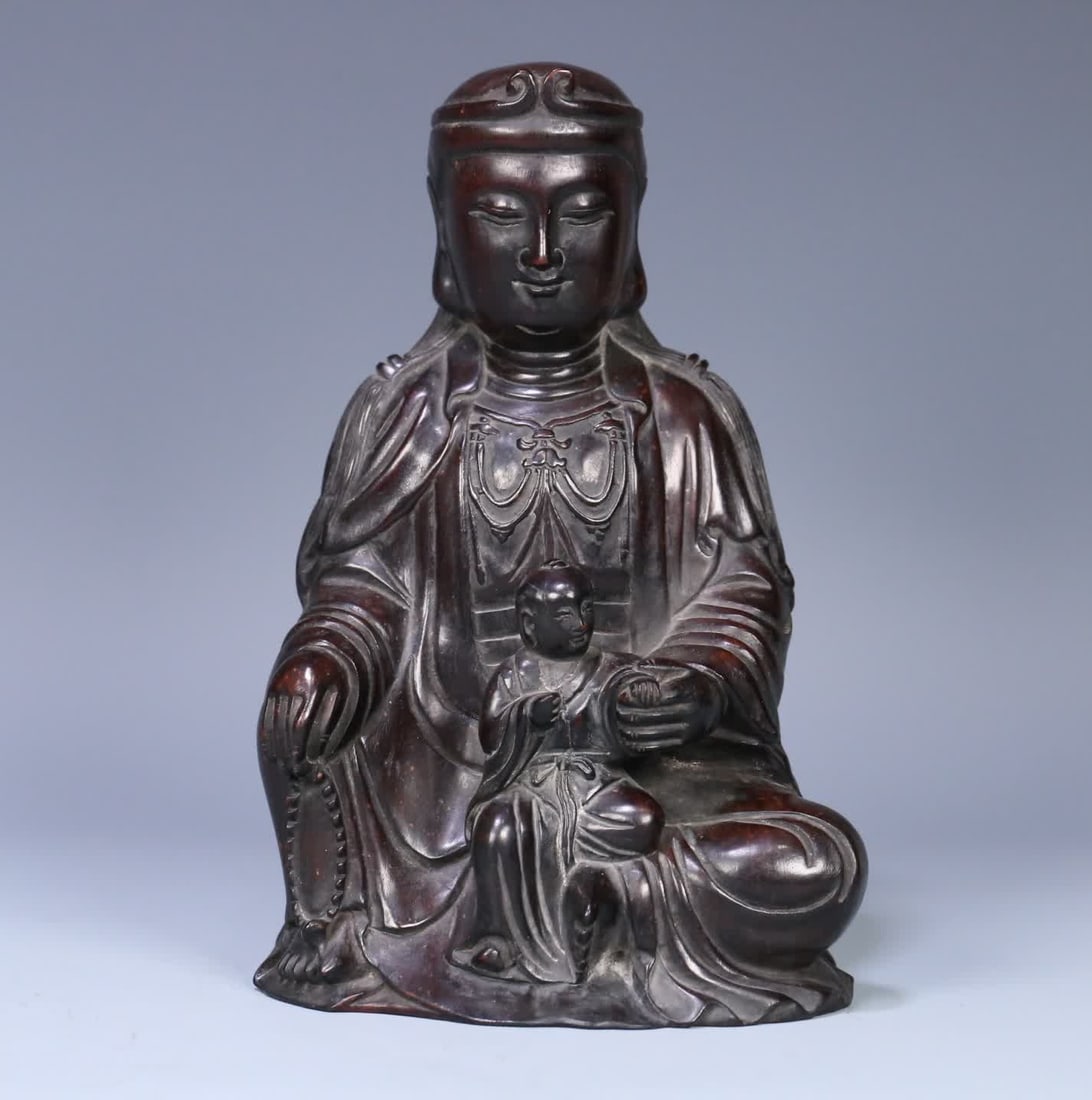 A Qing Dynasty Zitan wood Guanyin ornament for giving children (1 of 9)