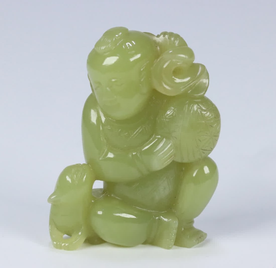A Qing Dynasty Hetian yellow jade boy playing with beasts: Qing Dynasty Hetian yellow jade boy playing with beasts SIZE: 5.21x4.04x1.79cm W:54g (The Dimensions Of All Batches Are Manually Measured.If You Need More Detailed Information, Please Contact Our Cust