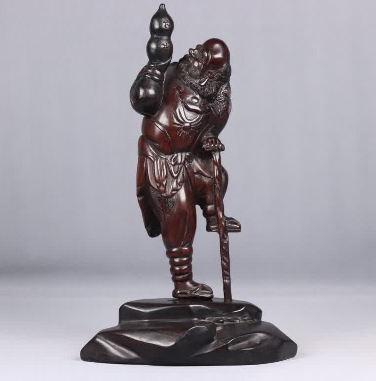 A late Qing dynasty small leaf rosewood iron cane plum carved piece with a base: Late Qing dynasty small-leaf rosewood with iron crutch plum carved parts with base SIZE: 26cm Net H: 22.6 x x W: 6.6 x x 4.6 cm Total W: 596g Net W: 278g (The Dimensions Of All Batches Are Manually Me