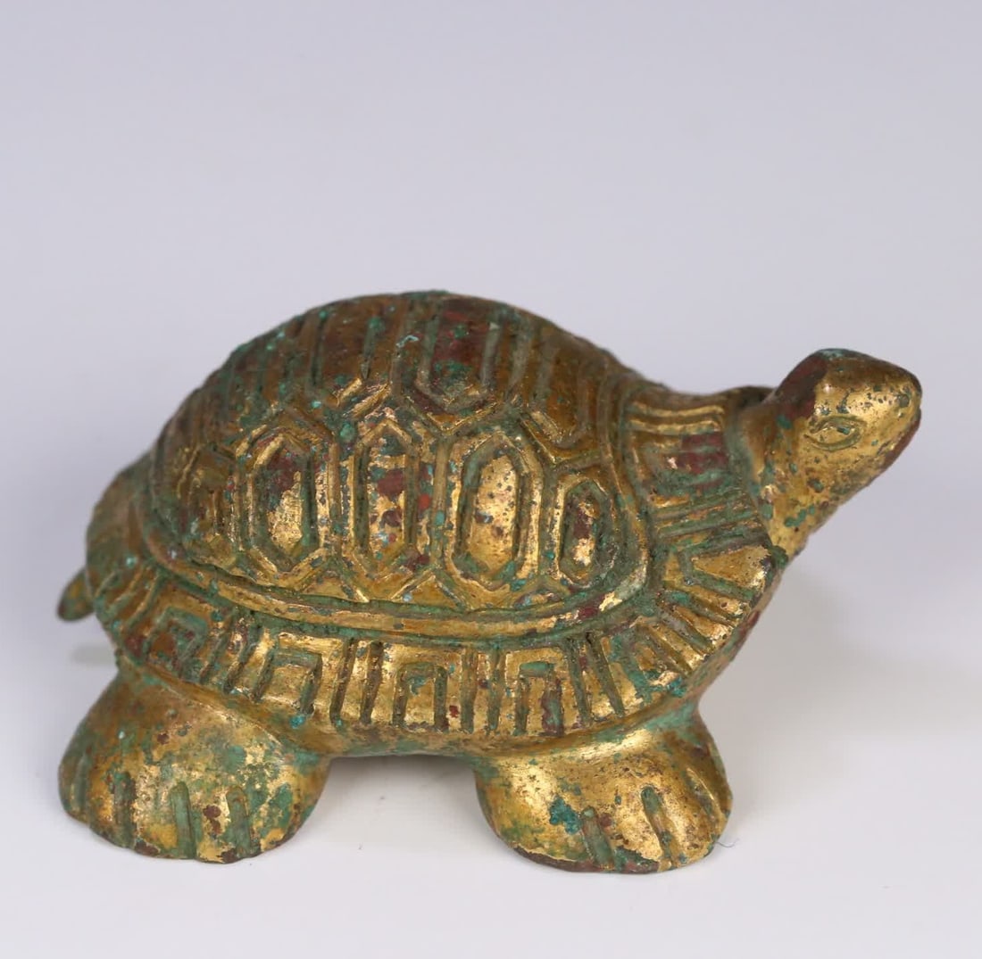 A Han Dynasty gilt bronze turtle-shaped ornament: Han Dynasty gilt bronze turtle-shaped ornament SIZE: 6.8x5.2x3.1cm W:210.3g (The Dimensions Of All Batches Are Manually Measured.If You Need More Detailed Information, Please Contact Our Customer Serv