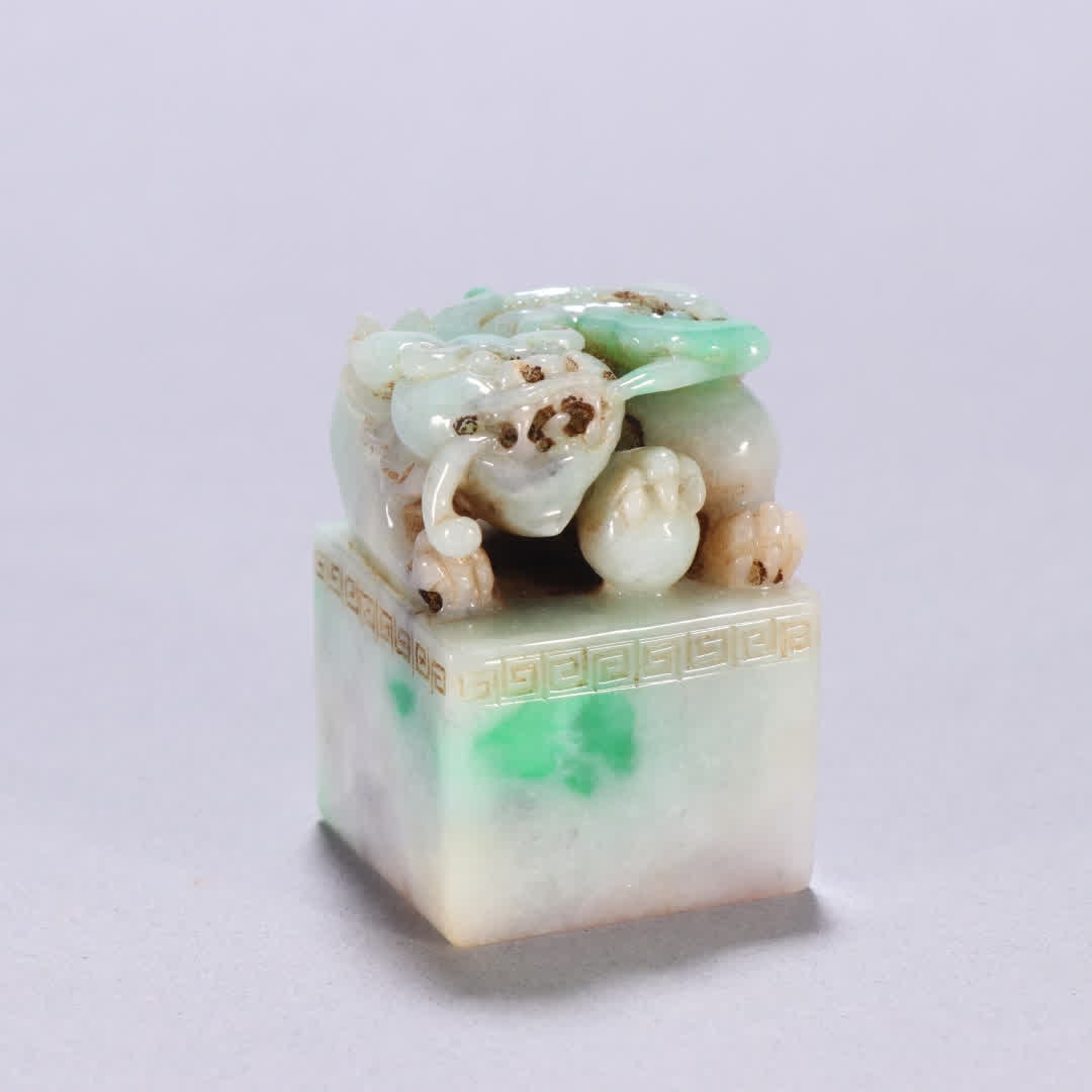 A Qing dynasty jade auspicious beast knob seal (1 of 9)