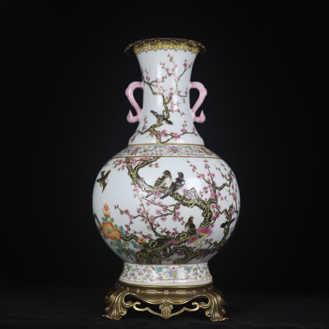 A Qing Dynasty famille rose magpie and plum blossom pattern inlaid with copper base and: A famille rose magpie and plum blossom pattern inlaid with copper base and double-handled vases from the Qing Dynasty SIZE: H:47cm Mouth D:14cm D:24cm Base diameter 21cm (The Dimensions Of All Batches