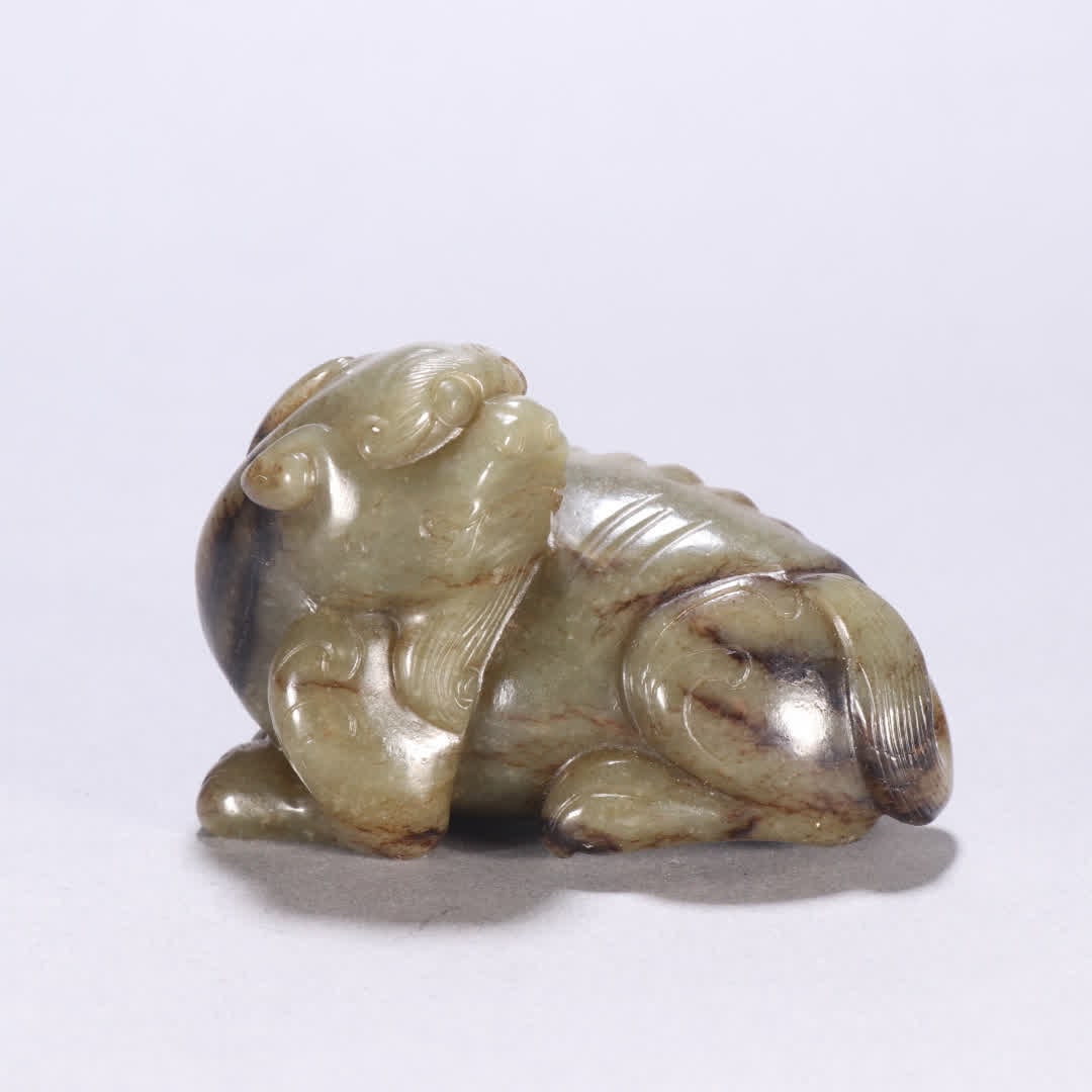 A Ming dynasty Hetian jade auspicious beast carving (1 of 9)