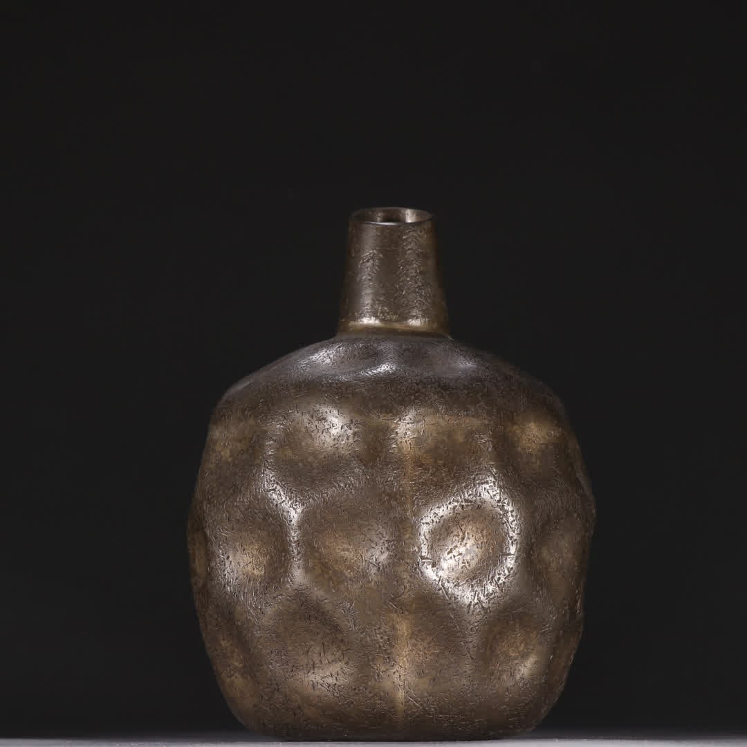 A flower vase with clear tin carved and hammered patterns (1 of 9)