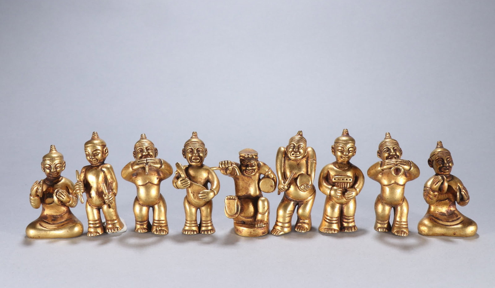 One set: a gilded Tang dynasty bronze musician (1 of 9)