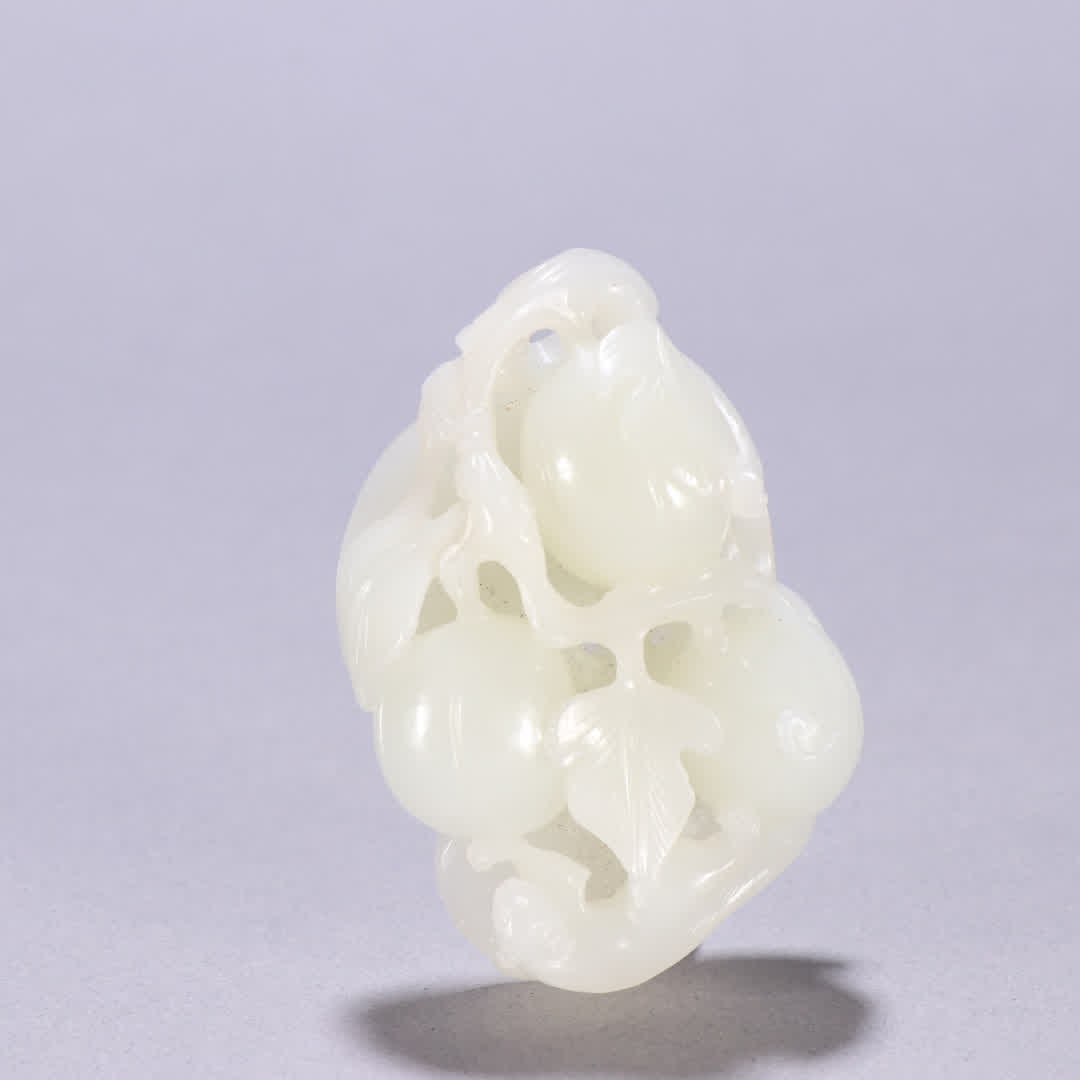 A Qing dynasty Hetian jade squirrel fruit carving (1 of 9)