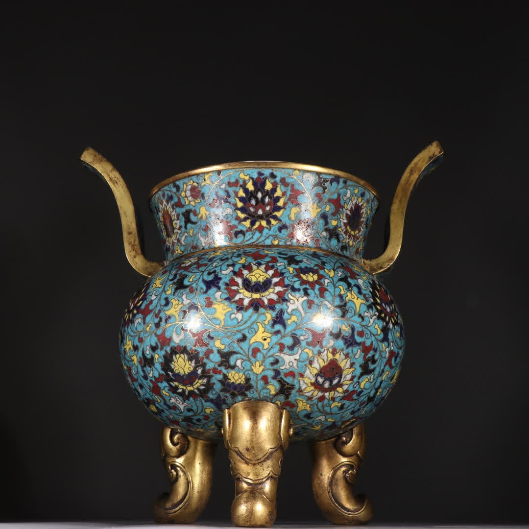 A Ming Dynasty bronze gilt cloisonne three-legged incense burner with entwined lotus patterns: Ming Dynasty bronze gilt cloisonne three-legged incense burner with entwined lotus patterns SIZE: H:25cm W:24.7cm W:2100.2g (The Dimensions Of All Batches Are Manually Measured.If You Need More Detail