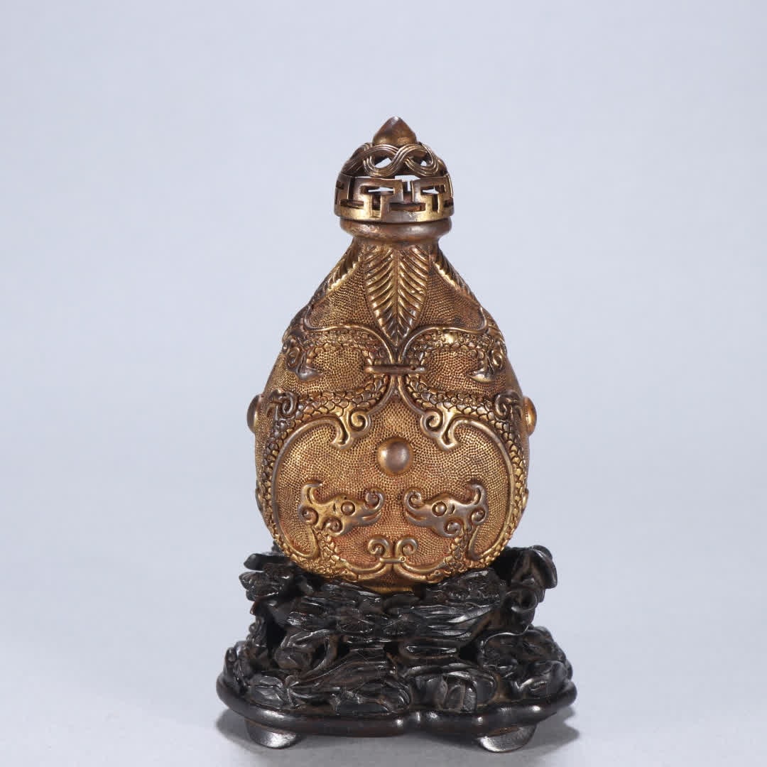 A Qing Dynasty gilt bronze snuff bottle with two dragons playing with pearls: Qing Dynasty Gilt Bronze Two Dragons Playing with a Pearl Snuff Bottle SIZE: H:8.9cm W:5.3cm Net W:200g (The Dimensions Of All Batches Are Manually Measured.If You Need More Detailed Information, Plea