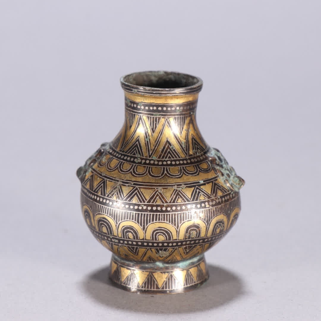 A Han dynasty bronze inlaid with gold and silver beast-ear zun vessel: Han Dynasty: bronze inlaid with gold and silver beast-ear zun vessels SIZE: H:5.7cm W:4.8cm W:125.4g (The Dimensions Of All Batches Are Manually Measured.If You Need More Detailed Information, Please 