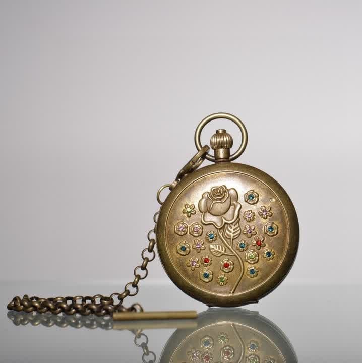 A 19th-century brass gilt pocket watch with rose pattern inlaid with gems: Nineteenth century: Gilt copper pocket watch with inlaid rose pattern SIZE: D:55mm (The Dimensions Of All Batches Are Manually Measured.If You Need More Detailed Information, Please Contact Our Custom