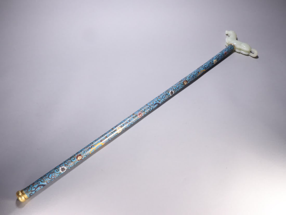 A Qing Dynasty bronze gilt cloisonne inlaid with a Hetian jade horse staff head: Qing Dynasty: Gilt bronze cloisonne inlaid with Hetian jade horse staff head SIZE: L:82cm W:16cm W:826.7g (The Dimensions Of All Batches Are Manually Measured.If You Need More Detailed Information, Pl