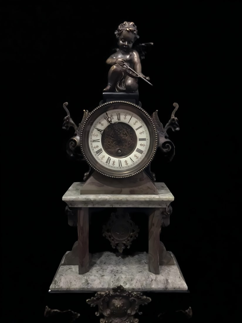 A late Qing European Rococo-style bronze carved angel marble table clock: Late Qing European Rococo-style bronze carved angel marble table clock SIZE: H:53cm L:24cm (The Dimensions Of All Batches Are Manually Measured.If You Need More Detailed Information, Please Contact Ou