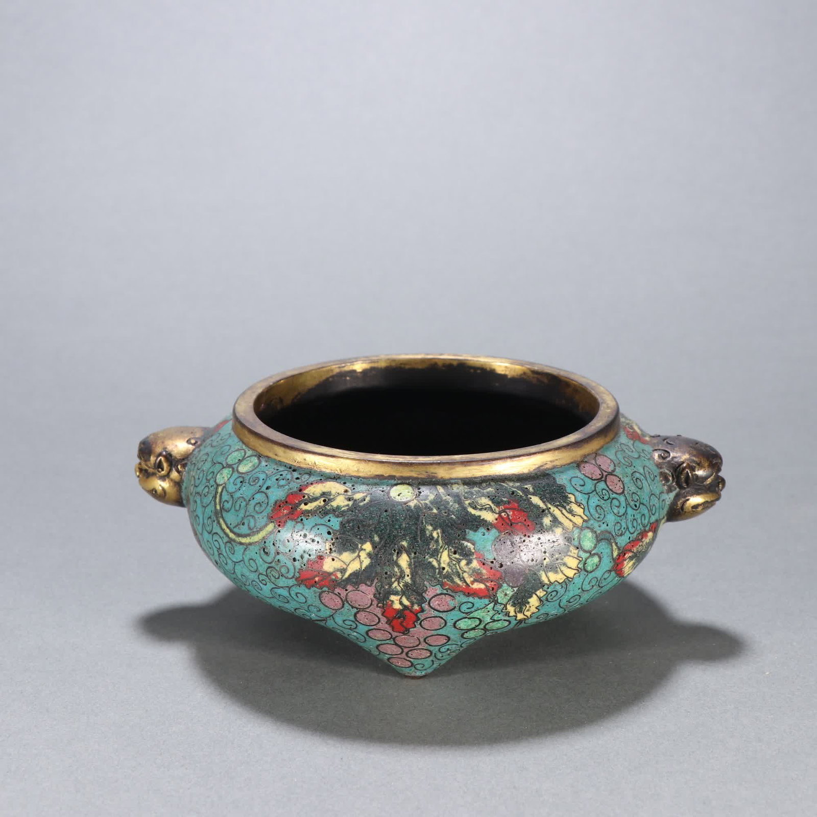 A Qing Dynasty bronze gilt cloisonne with beast-handled three-legged incense burner: Qing Dynasty Gilt Bronze Cloisonne Beast-Handle Three-Legged Incense Burner SIZE: Specifications: H:5.4cm W:14cm W:843.7g (The Dimensions Of All Batches Are Manually Measured.If You Need More Detailed