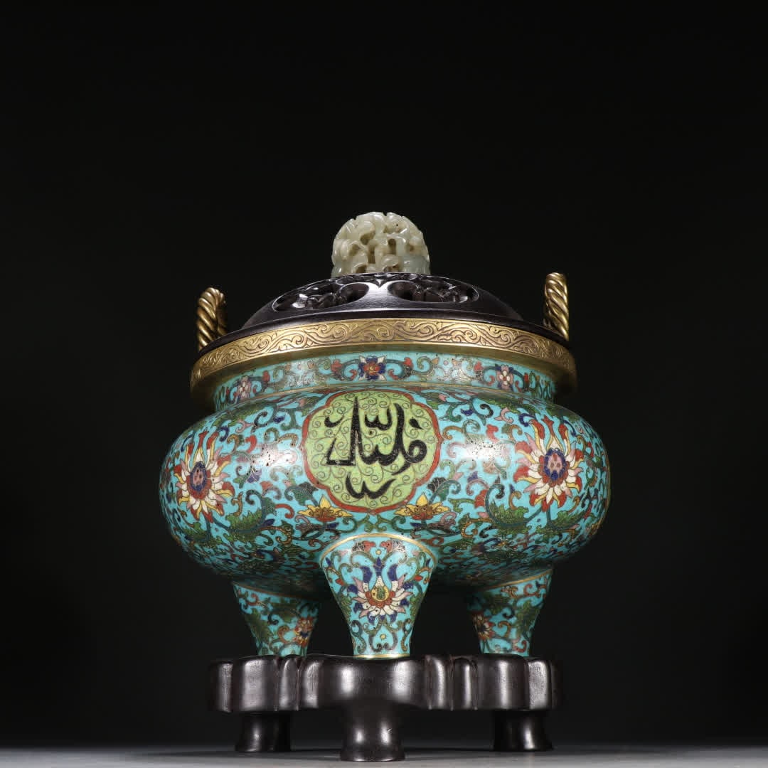 A Qing Dynasty bronze-gilt cloisonne three-legged incense burner with entwined lotus patterns (1 of 9)