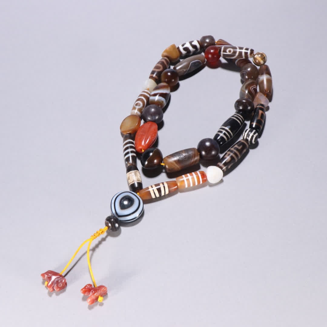 A Duobao Dzi bead necklace: Multi-Treasure Dzi Bead Necklace SIZE: W:4.6x1.3cm W:263.1g (The Dimensions Of All Batches Are Manually Measured.If You Need More Detailed Information, Please Contact Our Customer Service Before Biddi