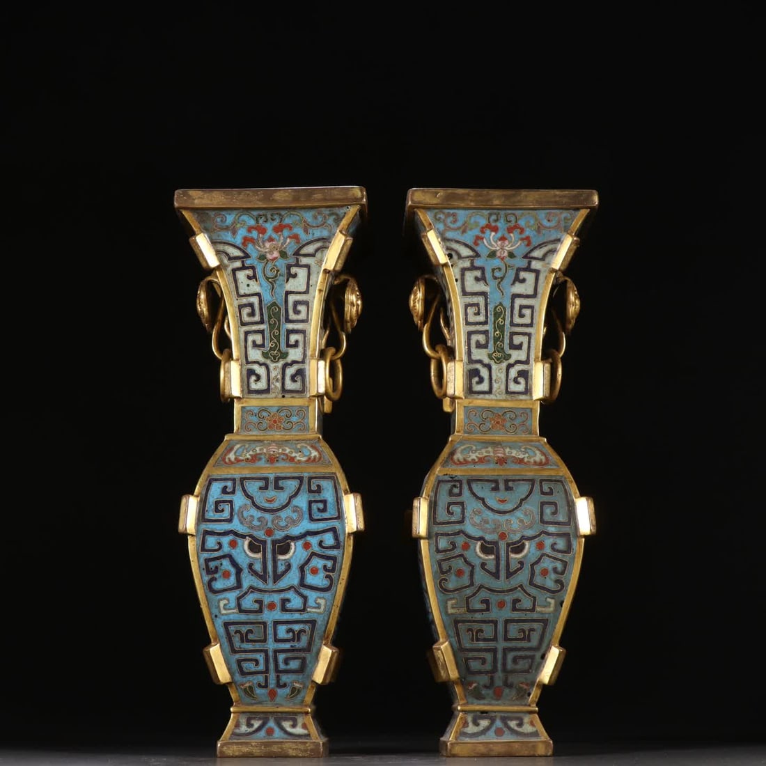 A pair of Qing dynasty bronze gilt cloisonne halberds with four directions: Qing Dynasty: A pair of gilt bronze cloisonne halberds with square halberds SIZE: H:22.2cm W:8.7cm Single W:652.6g (The Dimensions Of All Batches Are Manually Measured.If You Need More Detailed Inform