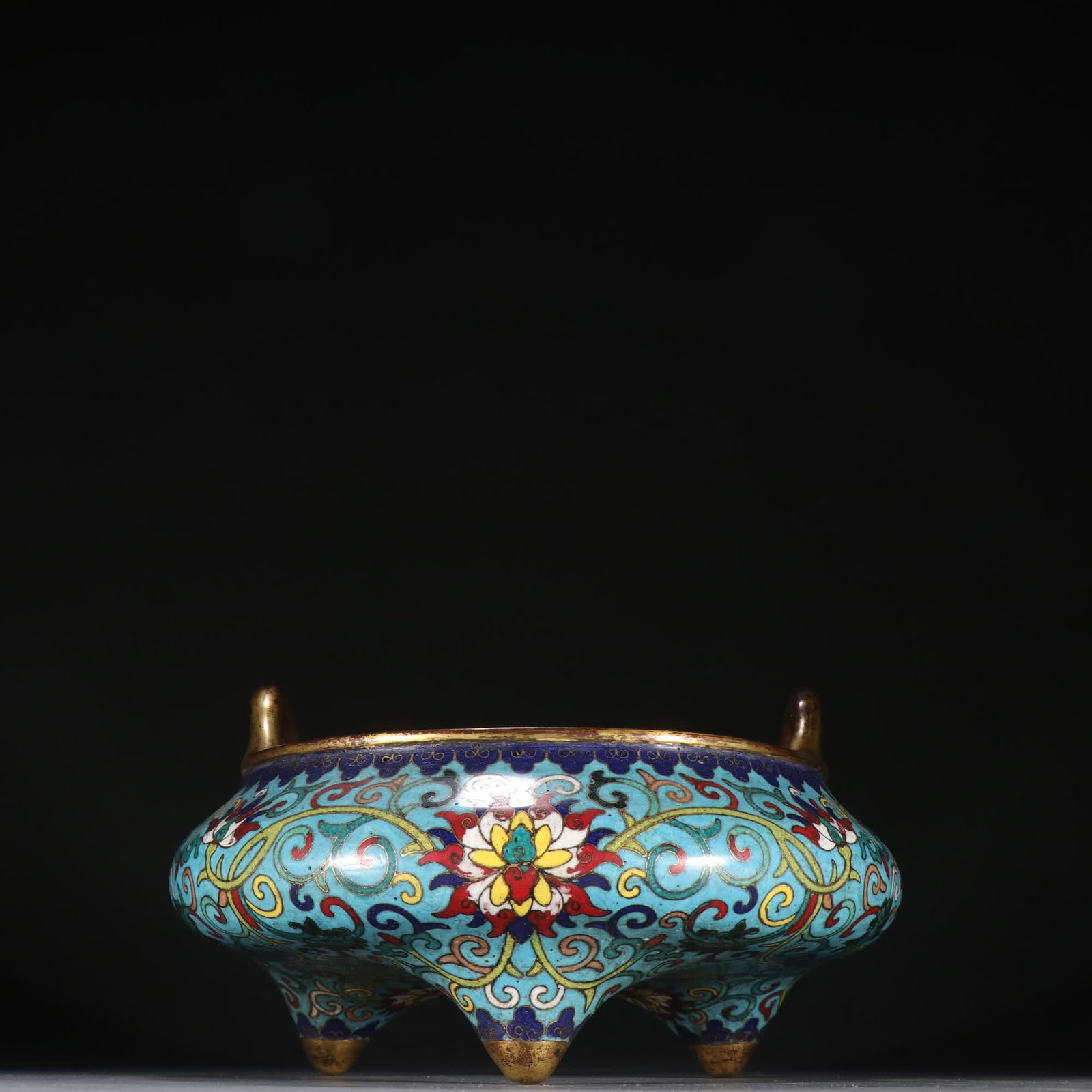 A Ming Dynasty Xuande Style Bronze Gilded Cloisonne Three-Legged Incense Burner with Lotus Pattern: Ming Dynasty Xuande Style Bronze Gilded Cloisonne Three-Legged Incense Burner with Entwined Lotus Pattern SIZE: Specifications: H:12cm W:21cm W:1610g (The Dimensions Of All Batches Are Manually Measur