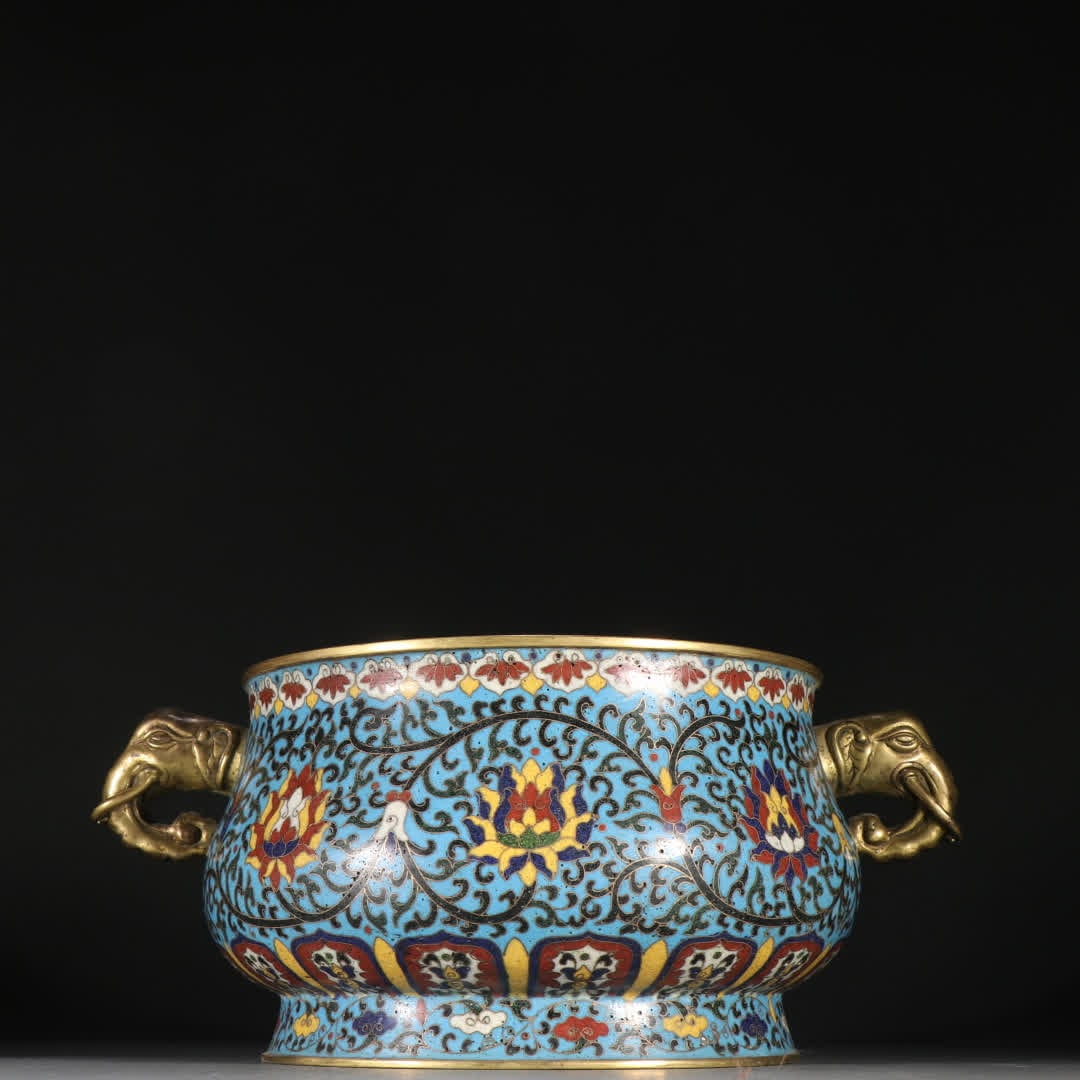 A Ming Dynasty Xuande mark copper cloisonne entwined lotus pattern elephant-headed incense burner: Ming Dynasty Xuande mark bronze cloisonne incense burner with entwined lotus branches and elephant-head ear incense burner SIZE: H:11cm W:26cm W:1447.5g (The Dimensions Of All Batches Are Manually Mea
