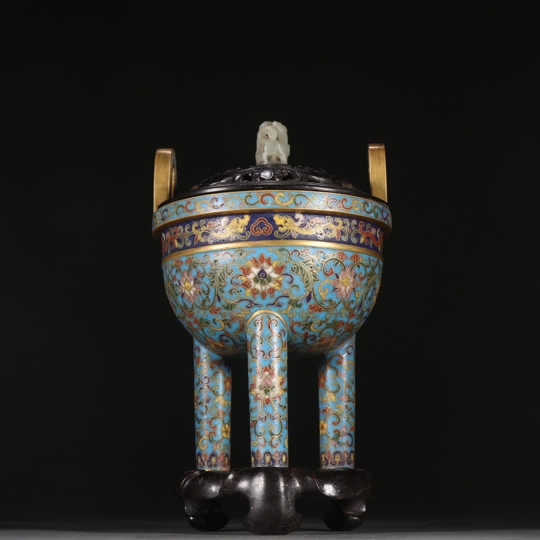 A Qing Dynasty bronze-gilt cloisonne three-legged incense burner with entwined lotus patterns: Qing Dynasty bronze gilt cloisonne three-legged incense burner with entwined lotus pattern SIZE: H:15.2cm W:11cm W:810g (The Dimensions Of All Batches Are Manually Measured.If You Need More Detailed I