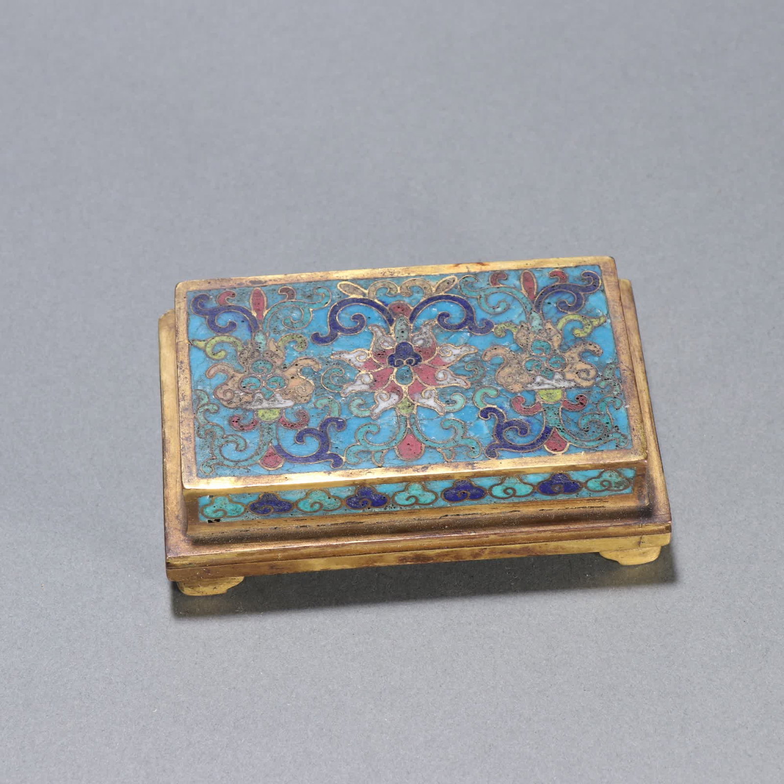 A Qing Dynasty bronze gilt cloisonne base with lotus entwined branches: Qing Dynasty bronze gilt cloisonne base with entwined lotus motif SIZE: Specifications: H: 2.7cm W: 9cm W: 270g (The Dimensions Of All Batches Are Manually Measured.If You Need More Detailed