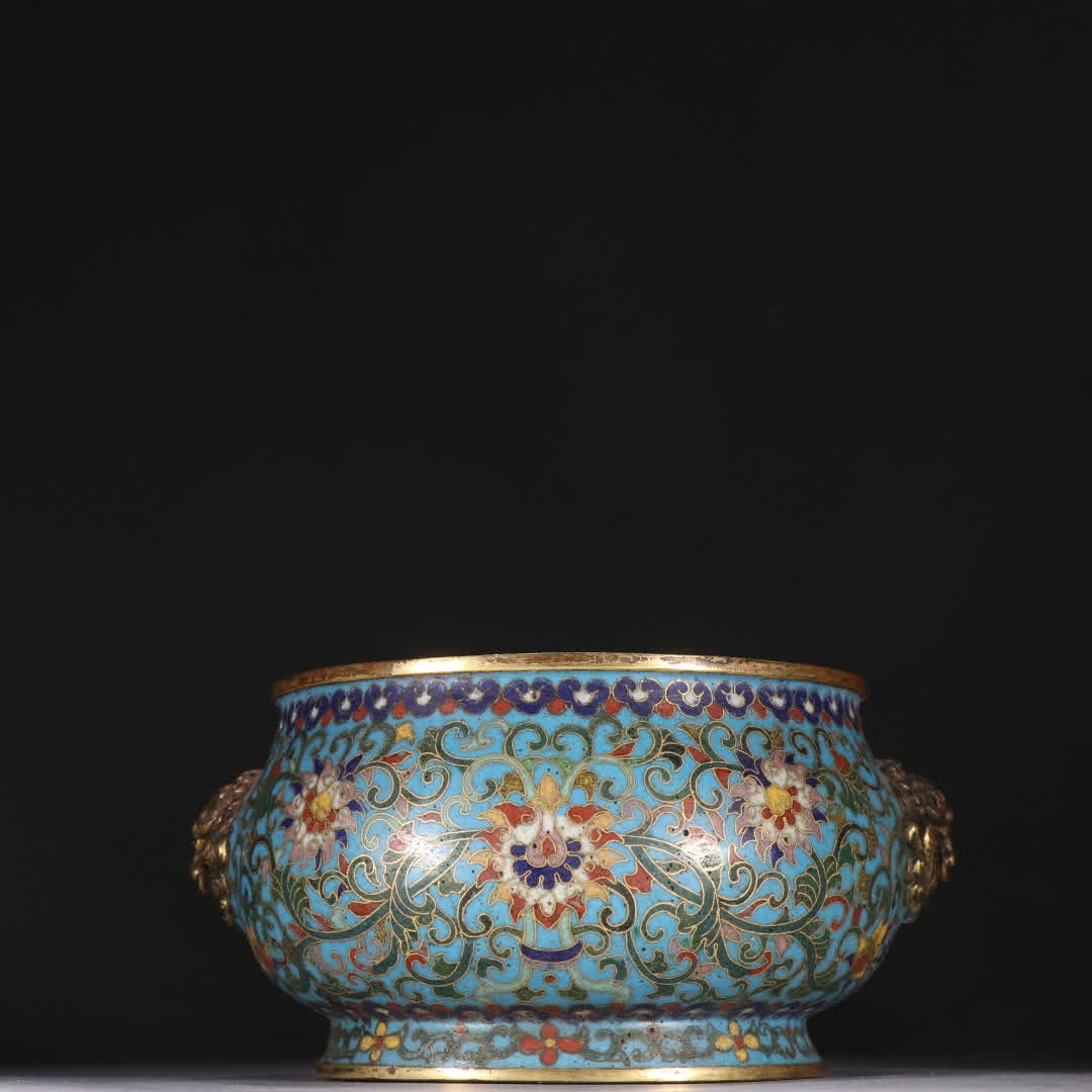 A Qing Dynasty bronze gilt cloisonne with twin lion-ear incense burners featuring lotus branches and: Qing Dynasty Gilt Cloisonne Twin Lion-Ear Incense Burner, Decorated with Lotus Branches SIZE: H:7.8cm W:14.8cm W:695.7g (The Dimensions Of All Batches Are Manually Measured.If You Need More Detailed
