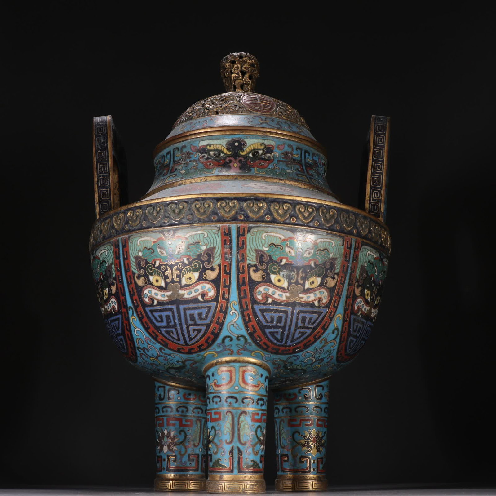 A Qing Dynasty bronze gilt cloisonne three-legged incense burner with beast-face motif: Qing Dynasty bronze gilt cloisonne beast-face three-legged incense burner SIZE: H:34.5cm W:22.3cm W:3090g (The Dimensions Of All Batches Are Manually Measured.If You Need More Detailed Information, Pl
