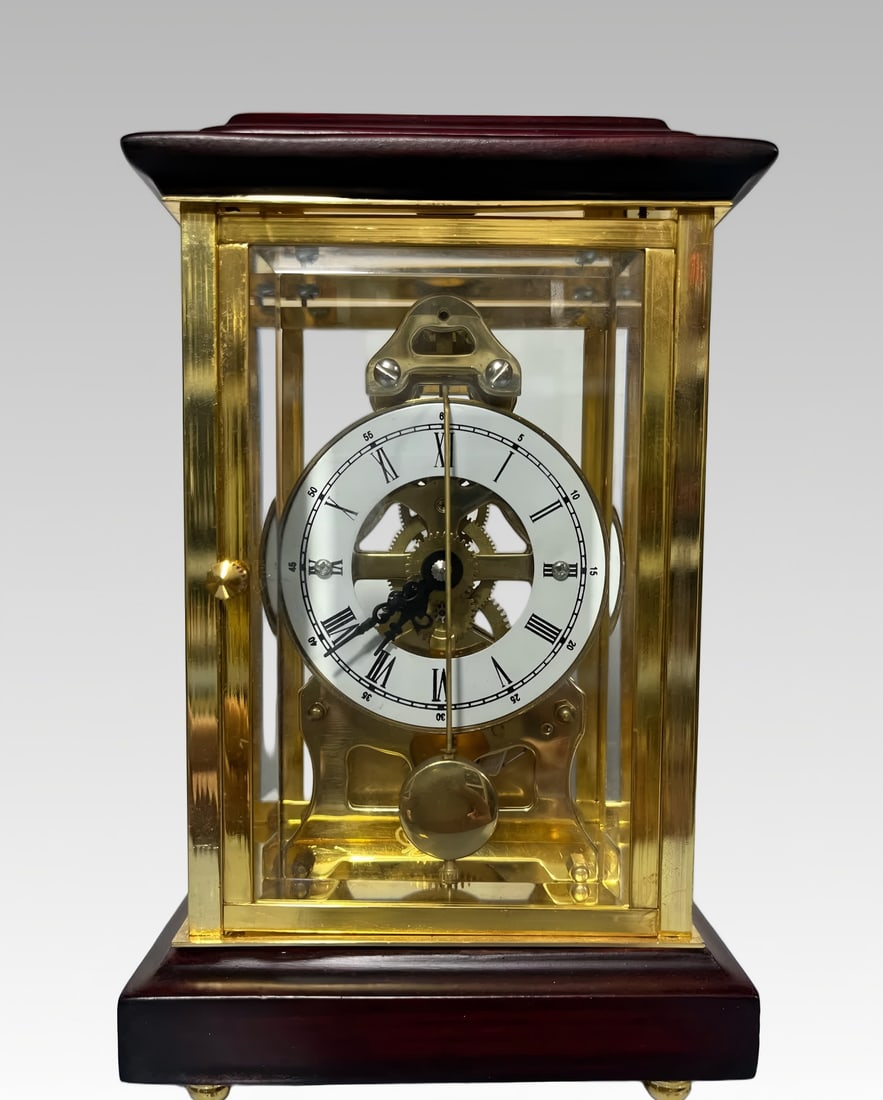 A late Qing dynasty gilded bronze dial with rosewood cover and base is a quick-swing timekeeping: A late Qing dynasty gilded bronze dial with a rosewood lid and base is a quick pendulum clock SIZE: L:10.5cm, W:8.5cm, H:17cm, Weight: 6651g (The Dimensions Of All Batches Are Manually Measured.If You