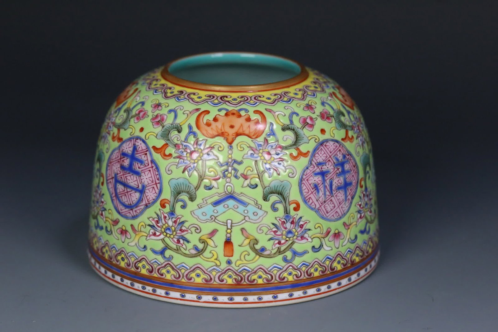 A Qing Jiaqing period with a green background and famille rose water vessel for auspicious and (1 of 9)