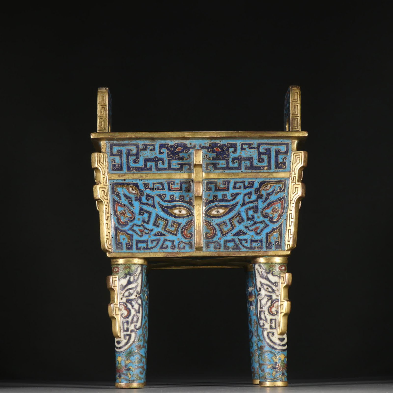 A four-legged incense burner gilded with gilt cloisonne indigo and taotie patterns: Bronze gilt cloisonne four-legged incense burner with gluttonous taotie pattern SIZE: H:22cm W:15.3cm W:1905.7g (The Dimensions Of All Batches Are Manually Measured.If You Need More Detailed Informati