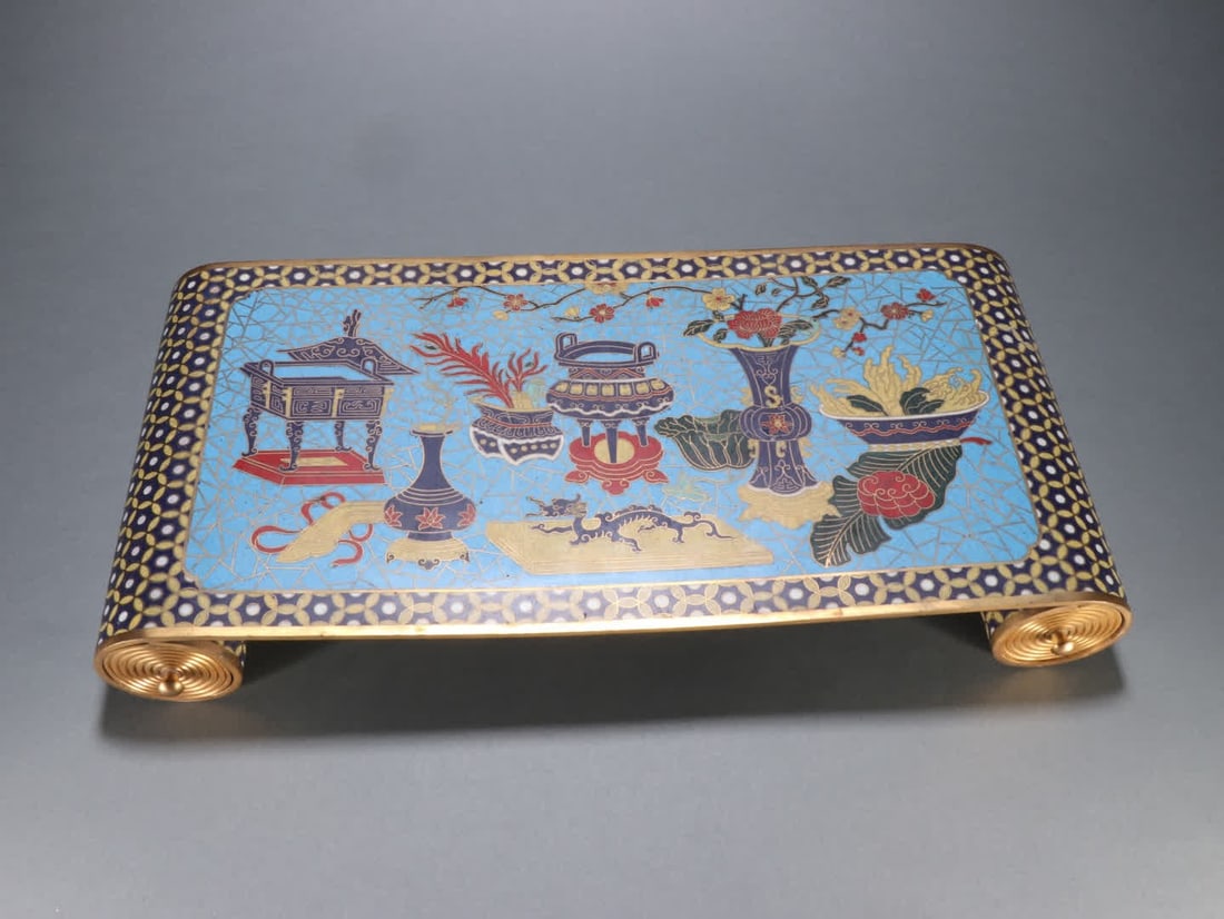 A Qing Dynasty bronze gilt cloisonne book scroll-shaped desk table: Qing Dynasty Gilt Bronze Cloisonne Scroll-shaped Table for Ancient Books SIZE: H:6cm W:42cm W:4672.3g (The Dimensions Of All Batches Are Manually Measured.If You Need More Detailed Information, Please