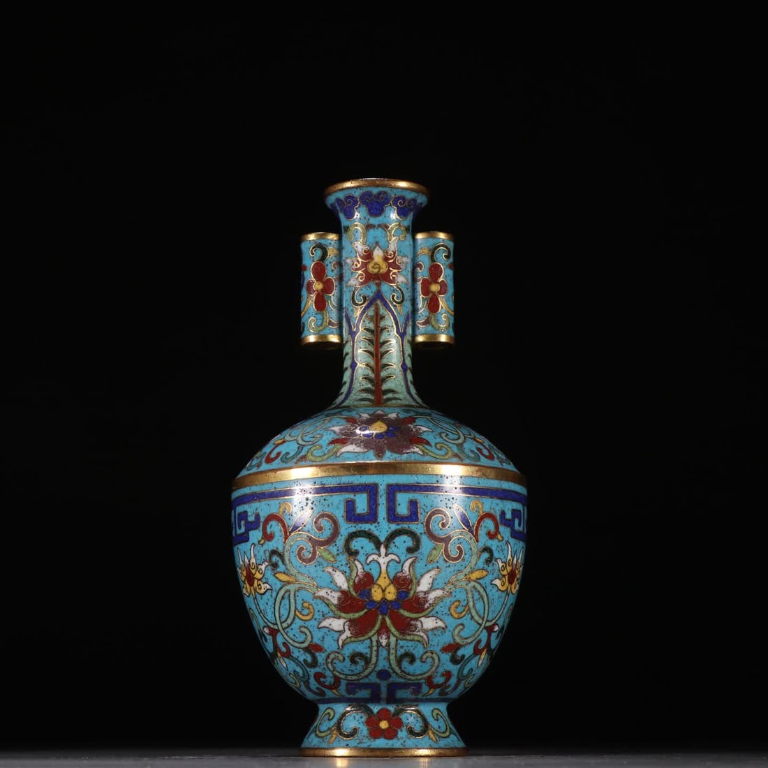 A Qing Dynasty bronze-bodied cloisonne entwined lotus with a double ear vase: Qing Dynasty copper-bodied cloisonne entwined lotus stem ear vase SIZE: H:18cm W:8.7cm W:550g (The Dimensions Of All Batches Are Manually Measured.If You Need More Detailed Information, Please Contact
