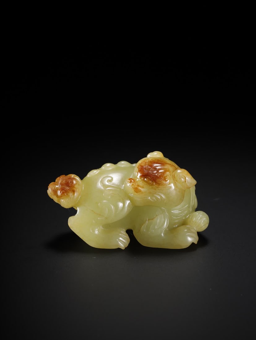 A Hetian yellow jade auspicious beast: The auspicious beast of Hetian yellow jade SIZE: 6.7??3.0??3.8cm W:97g (The Dimensions Of All Batches Are Manually Measured.If You Need More Detailed Information, Please Contact Our Customer Service B