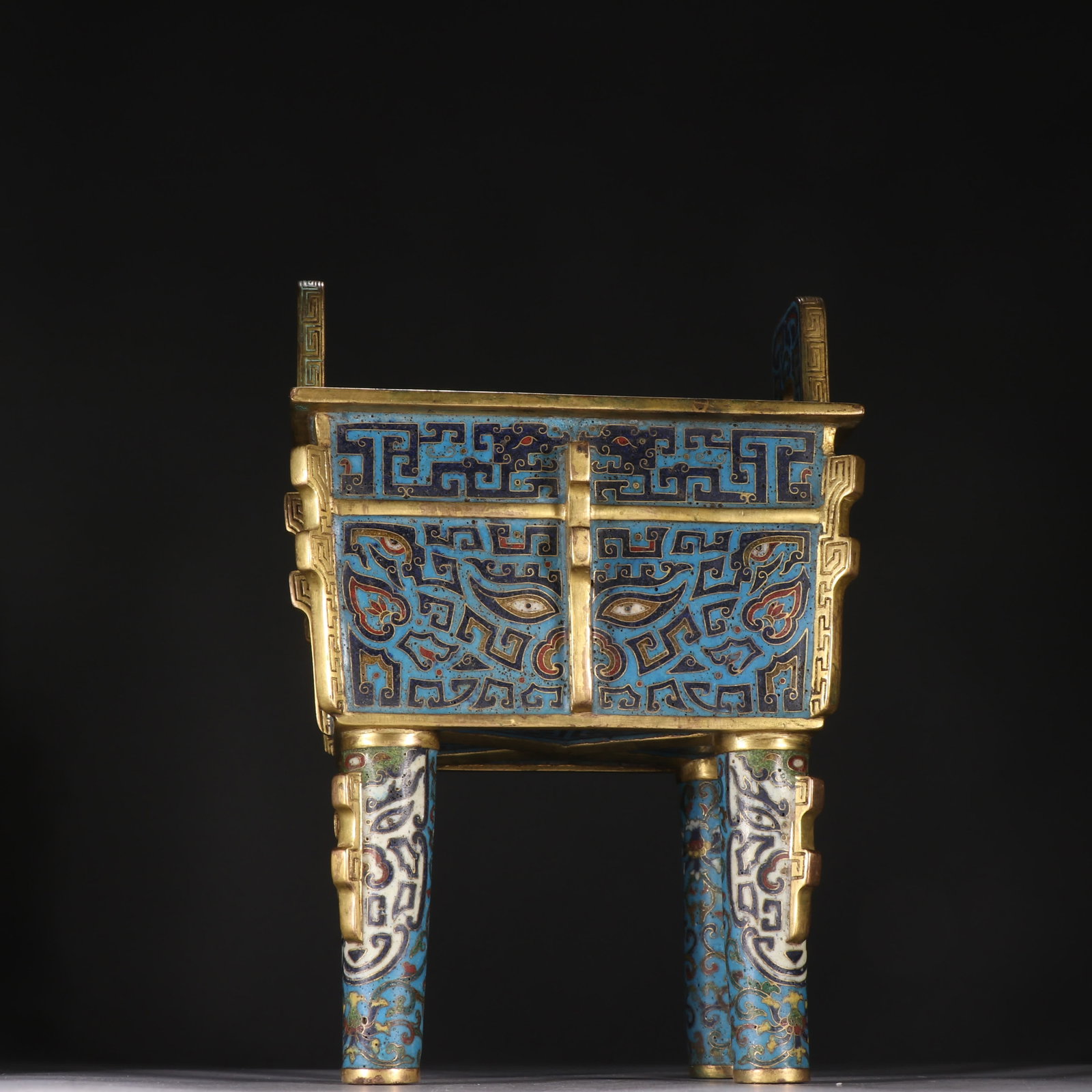 A four-legged incense burner gilded with gilt cloisonne indigo and taotie patterns: Bronze gilt cloisonne four-legged incense burner with gluttonous taotie pattern SIZE: H:22cm W:15.2cm W:1906.3g (The Dimensions Of All Batches Are Manually Measured.If You Need More Detailed Informati