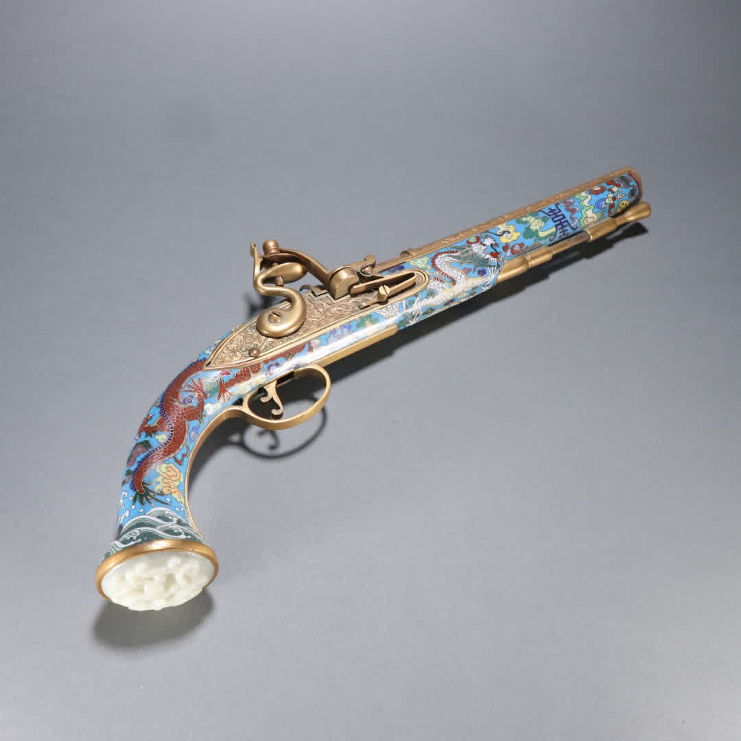A Qing Dynasty copper gilt cloisonne inlaid jade dragon pattern firearm: Qing Dynasty Gilt Cloisonne Inlaid Jade Dragon Pattern Firearm SIZE: L:45cm W:18.2cm W:1586.7g (The Dimensions Of All Batches Are Manually Measured.If You Need More Detailed Information, Please Contac