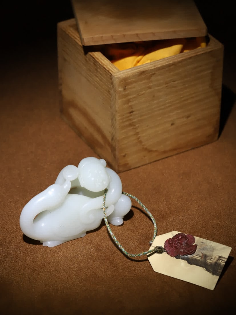 A Qing Dynasty Hetian white jade piece titled "Boy Playing with Geese.": Qing Dynasty Hetian White Jade 'Boy Playing with Geese' Handle Piece: European Return ?? Qing Dynasty Hetian White Jade 'Boy Playing with Goose' handle piece, comes with an old wooden box, yellow silk