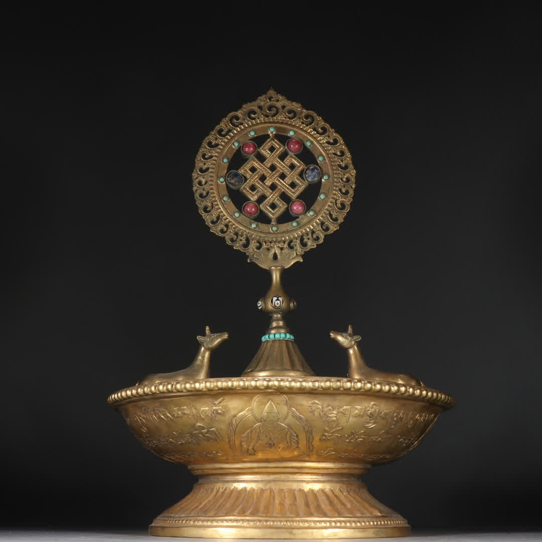 A Qing Dynasty copper gilt inlaid with heavenly inlaid gemstone Dharma wheel offering vessel: Qing Dynasty Gilt Bronze Inlaid Jewel Stone Dharma Wheel Offering Vessel SIZE: H:32cm W:23cm W:2840.1g (The Dimensions Of All Batches Are Manually Measured.If You Need More Detailed Information, Pleas