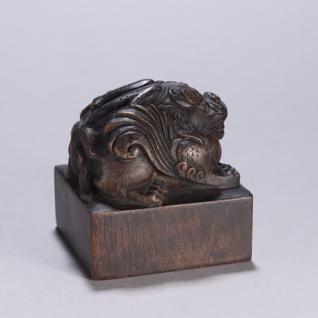 A Qing Dynasty seal with an agarwood auspicious beast knob: Qing Dynasty Agarwood Auspicious Beast Knob Seal SIZE: H:6.4cm W:6.2cm W:171.1g (The Dimensions Of All Batches Are Manually Measured.If You Need More Detailed Information, Please Contact Our Customer 