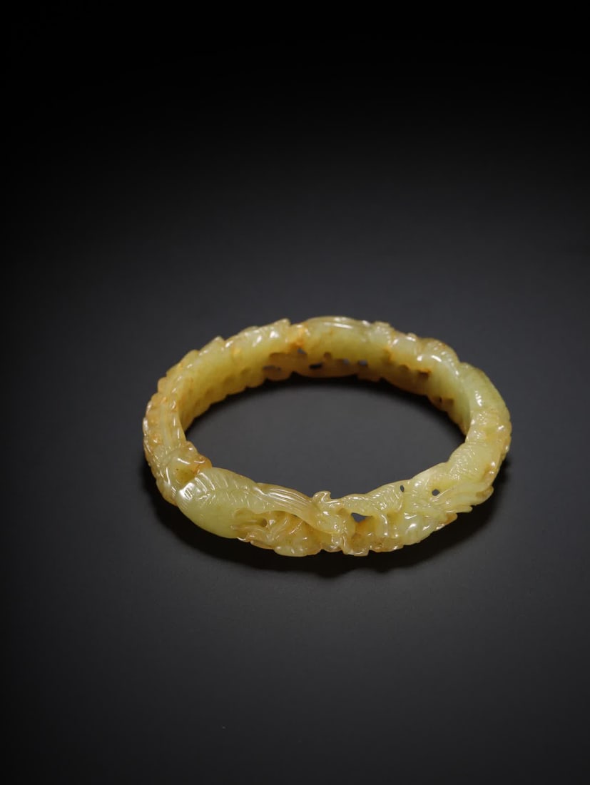 One is a Hetian yellow jade bracelet with dragon and phoenix patterns: Hetian yellow jade dragon and phoenix pattern bracelet SIZE: Inner diameter 5.6cm W: 1.3cm W: 37g (The Dimensions Of All Batches Are Manually Measured.If You Need More Detailed Information, Please Con