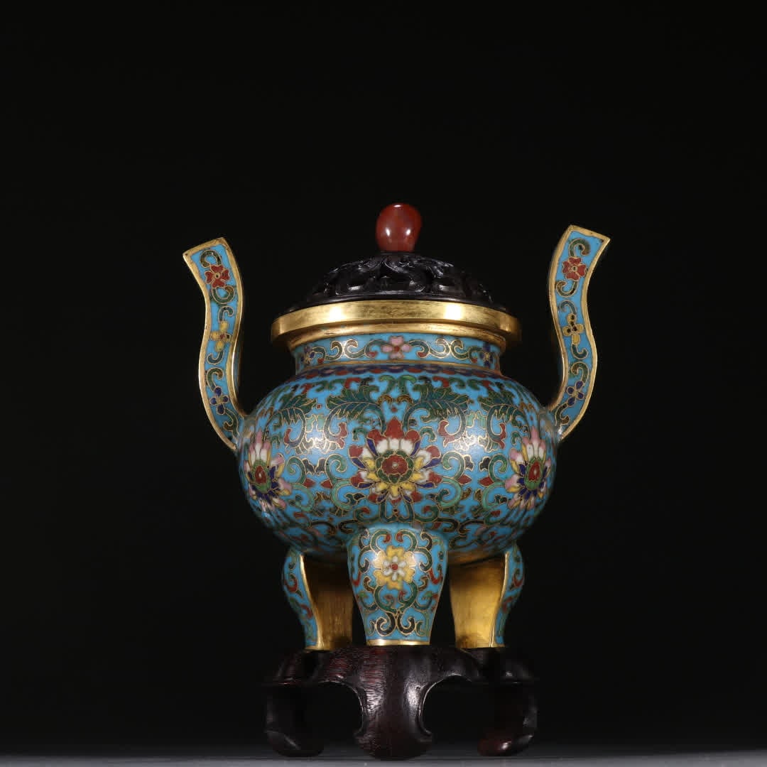 A Qing Dynasty bronze gilt cloisonne entwined lotus with crown handles and a three-legged incense: Qing Dynasty bronze gilt cloisonne entwined lotus flower crown tripods incense burner SIZE: H:13cm W:12.1cm W:434.7g (The Dimensions Of All Batches Are Manually Measured.If You Need More Detailed Info