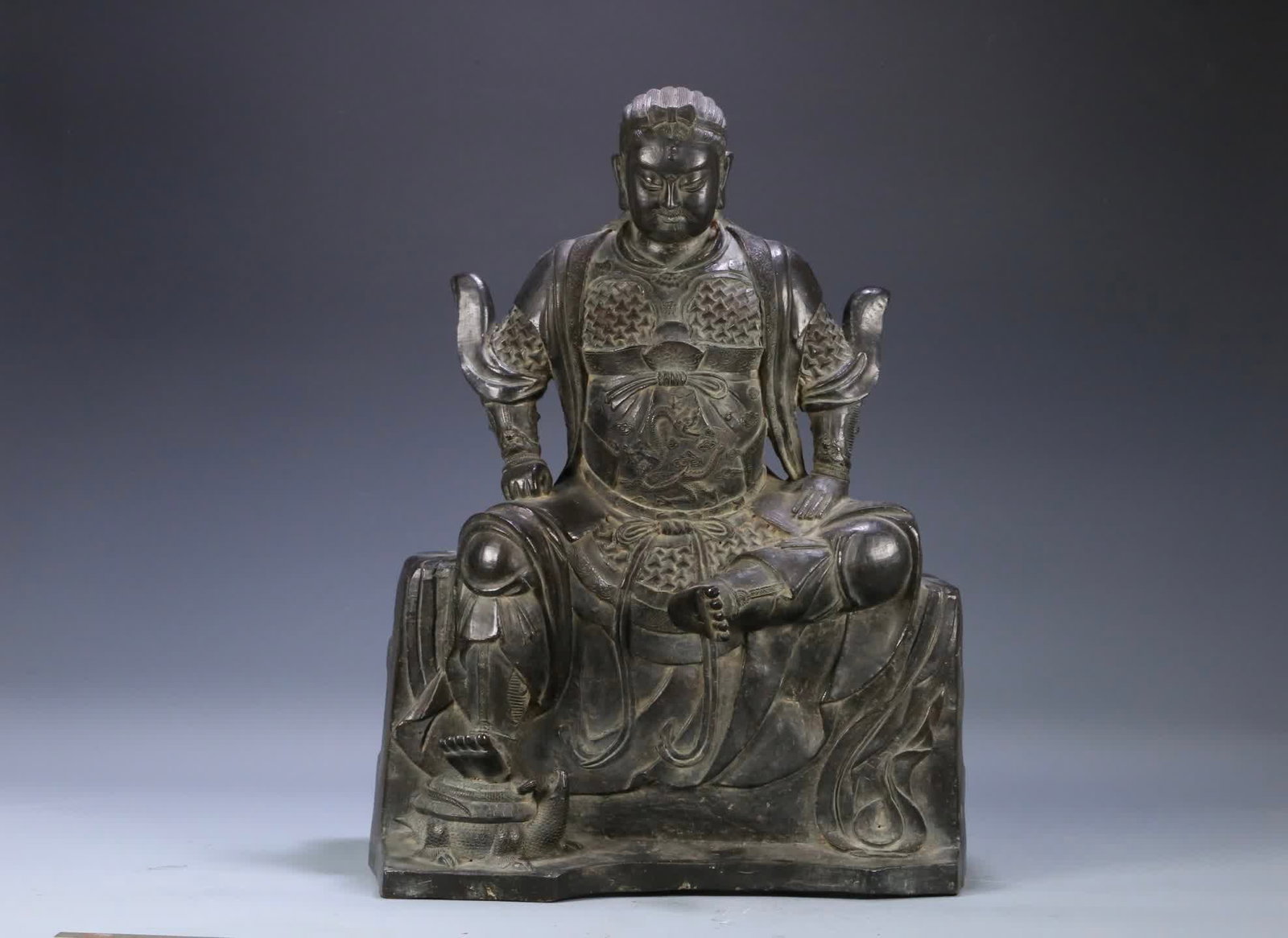 A Ming Dynasty bronze-embellished statue of the True Martial Great Emperor: Ming Dynasty: Seated statue of the True Martial Emperor with bronze plaster SIZE: 55x41x24cm W:23.75kg (The Dimensions Of All Batches Are Manually Measured.If You Need More Detailed Information, Pleas